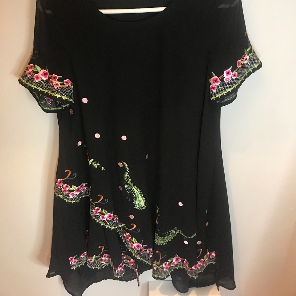 black dress with embroidered details